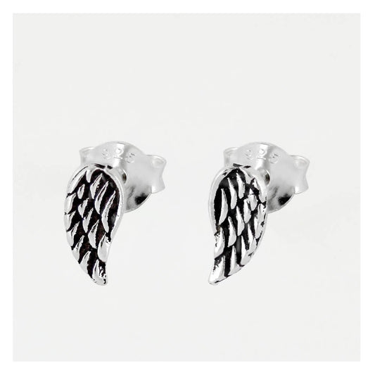 Close up of angel wing studs and scroll backs in sterling silver.